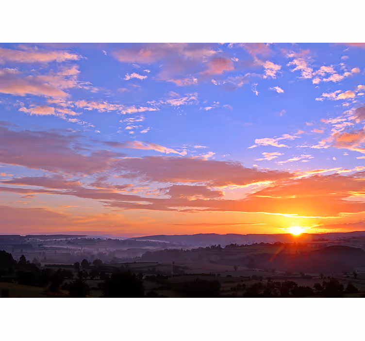 Foto tapeta zalazak sunca nad brežuljcima - TenStickers